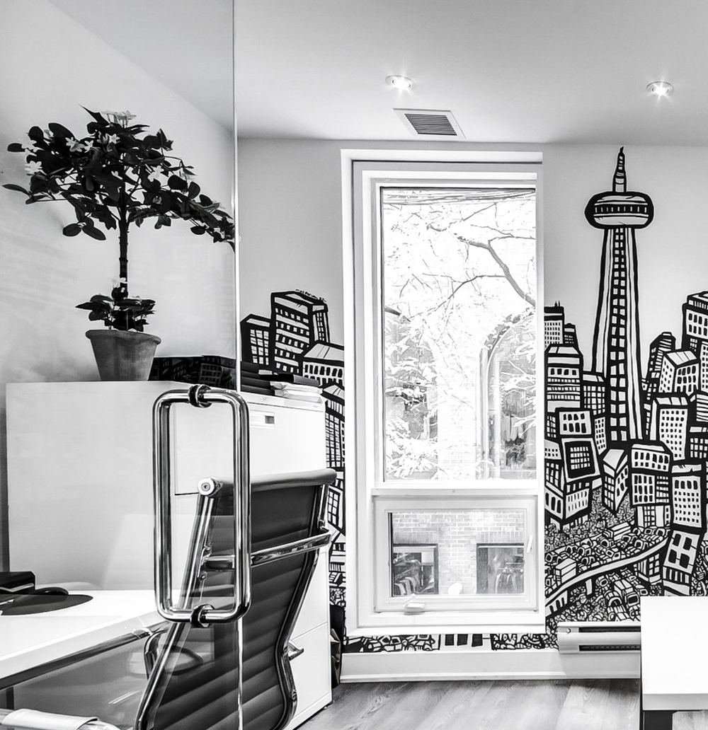 Forest Hill office interior with a hand-drawn Toronto skyline mural